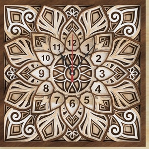 May include: A wooden clock with a mandala design. The clock face is white with black numbers and hands. The clock is surrounded by a brown wooden frame.