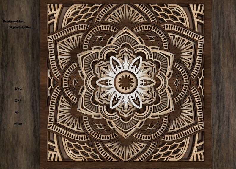 Op de afbeelding: Een lasergesneden mandala-ontwerp met ingewikkelde details in bruin en wit. Het ontwerp is ingelijst in een donkerhouten lijst.
