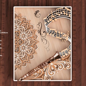 Può includere: Un'opera d'arte in legno a strati con un clarinetto, note musicali e un design a mandala. L'opera è nei toni del marrone e del beige, con intricati dettagli ritagliati. Il testo "Designed by: DigitalLifeStore" è visibile.