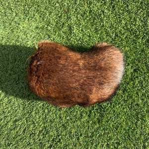 A “molten fox” fursuit nub tail