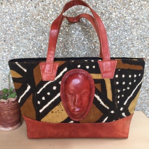 SCHLAMMSCHUTZ HANDTASCHE