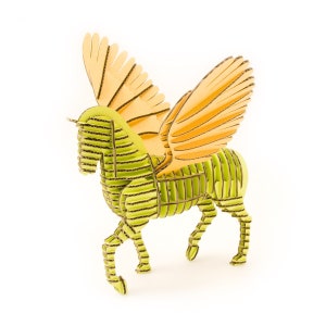 May include: A green and orange cardboard model of a winged horse, or pegasus. The model is made of corrugated cardboard and is assembled in a standing position.