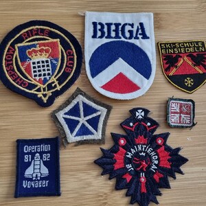 Joblot 7x Vintage Cloth Patch Badges 81-82 voyager,  ski-Schule, rifle club, BHGA, military All as shown.