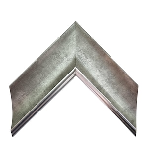 May include: A corner section of a picture frame featuring a metallic silver finish with a distressed, textured surface. The frame has a wide, angled profile that slopes inward toward the inner edge, creating a sharp, clean V-shaped corner joint.