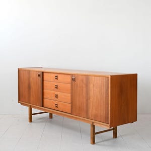 Vintage 1960s Swedish Teak Sideboard with Sliding Doors & Sculpted Wood Handles – Mid-Century Modern Storage