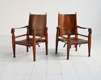 Par de sillones safari escandinavos vintage, de los años 50, de haya y cuero original, estilo moderno de mediados de siglo de Kaare Klint.