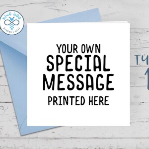 May include: A white card with black text that reads "Your Own Special Message Printed Here". The card is on a blue envelope and a white wooden surface. The text "Type 1" is written in blue on the right side of the image.