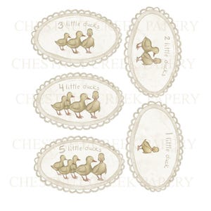 May include: A set of oval cards with scalloped edges, each displaying a number of light yellow ducks. The text on the cards reads "1 little duck", "2 little ducks", "3 little ducks", "4 little ducks", and "5 little ducks".