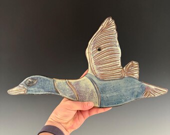 Handmade ceramic goose wall hanging. can be hung indoor or out.