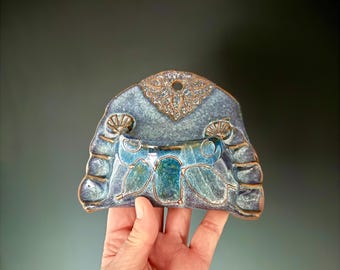 Handmade wall pocket. Can be hung indoor or outdoor.