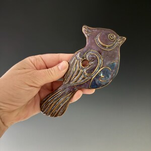 Handmade ceramic titmouse wall hanging. This can be hung indoor or out.