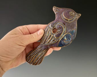 Handmade ceramic titmouse wall hanging. This can be hung indoor or out.