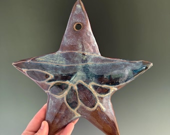 Wall hanging handmade ceramic star. Indoor/outdoor