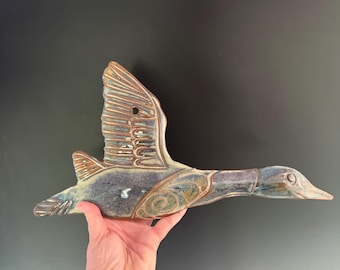 Handmade ceramic goose wall hanging. can be hung indoor or out.