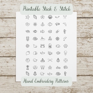 Puede incluir: Una hoja blanca con dibujos lineales negros de varias criaturas marinas y elementos náuticos. El texto "Printable Stick & Stitch" y "Hand Embroidery Patterns" se muestra en una pancarta verde.
