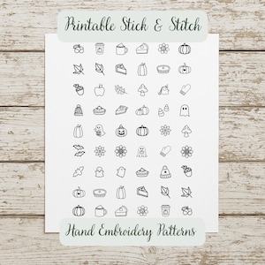 May include: A white sheet featuring black line art icons for embroidery, including pumpkins, ghosts, leaves, flowers, pies, and mugs. The text at the top reads Printable Stick & Stitch and the text at the bottom reads Hand Embroidery Patterns.