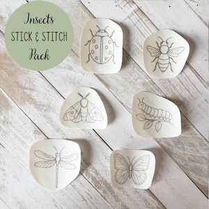 May include: A pack of insect-themed stick and stitch embroidery designs. The designs include a ladybug, bee, moth, caterpillar, dragonfly, and butterfly. The text "Insects STICK & STITCH Pack" is in a green circle in the upper left corner.