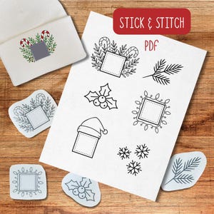 May include: A white beanie with a Christmas candy cane and leaf design, along with several sticker designs featuring holiday-themed illustrations. The text "STICK & STITCH PDF" is visible.