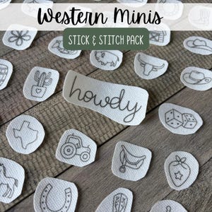 May include: A collection of white fabric stick and stitch embroidery patches featuring black line art designs including a cactus, a tractor, a horseshoe, a horse, a bull skull, a cowboy hat, dice, and the word howdy in cursive script.