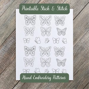 May include: A white sheet featuring black line art of various butterfly designs, labeled Printable Stick & Stitch and Hand Embroidery Patterns. The sheet contains multiple butterfly illustrations in different sizes and styles, including floral and celestial motifs.