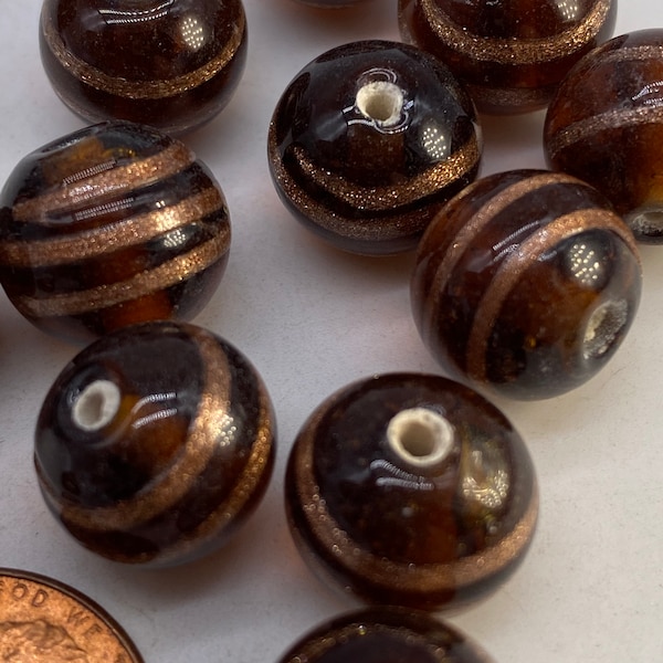 Hand made glass beads from India. Amber/gold (20 pieces per price)