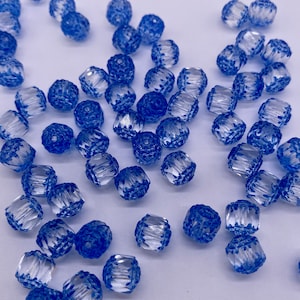 Faceted glass cathedral barrel bead. 8mm. Clear/ Blue ( 30 peices per price)
