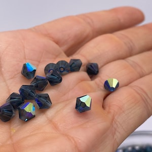 Royal blue with AB coating 6mm Bicone glass bead. (60 pieces per price)