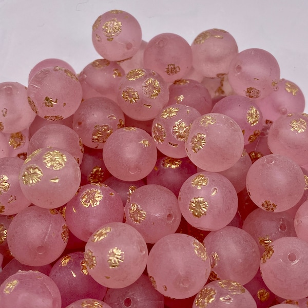 Pretty vintage lucite round bead. Frosty pink with tiny stamped gold flowers, 11mm ( 20 peices per price)