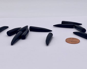 36mm Black bone spike/daggers. Top center hole. ( 20 peices per price)
