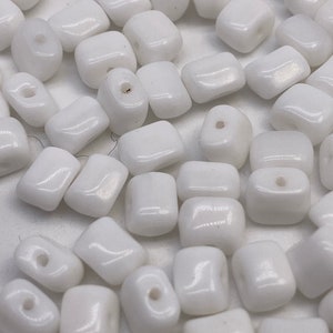 Small opaque white rectangular glass beads, (300 pieces per price)