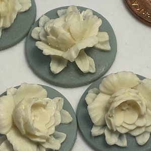 3D white rose cameo on light blue base.( 4 pieces per price)