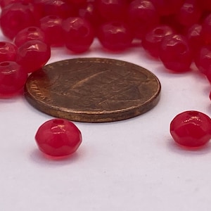 Bright transparent Fuchsia saucer facetted 5mm bead. Acrylic ( 75 pieces per price)
