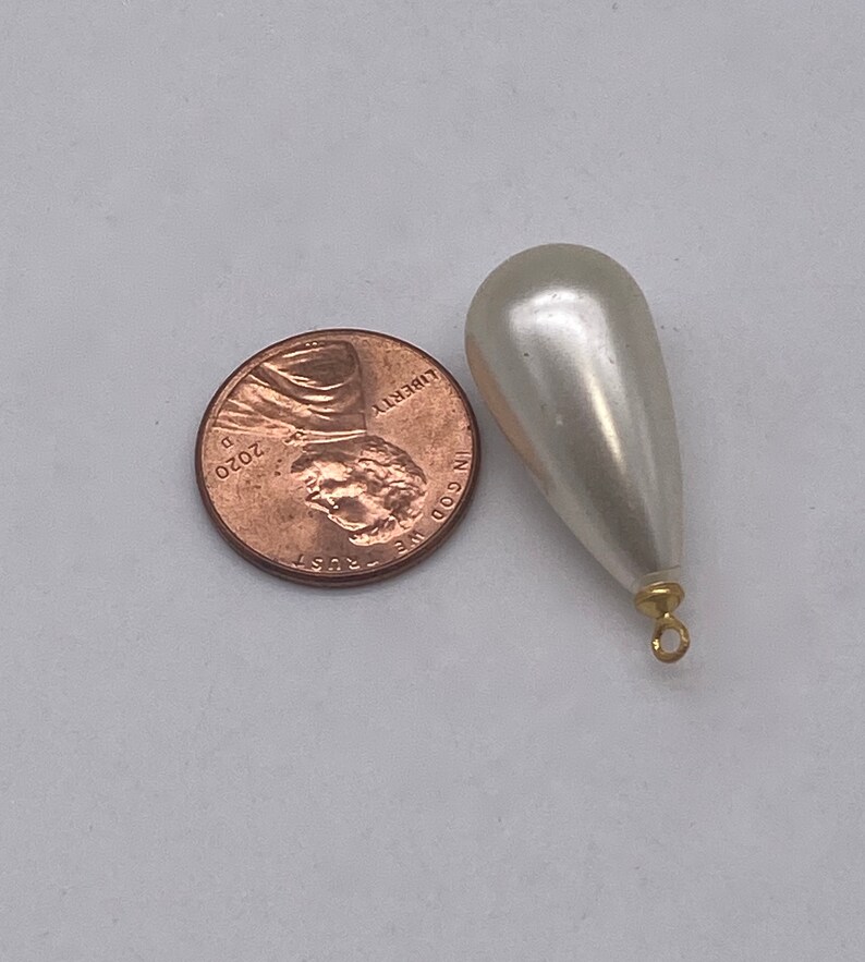 Large Pearly teardrops with gold plated eye pin. 12 pieces per price