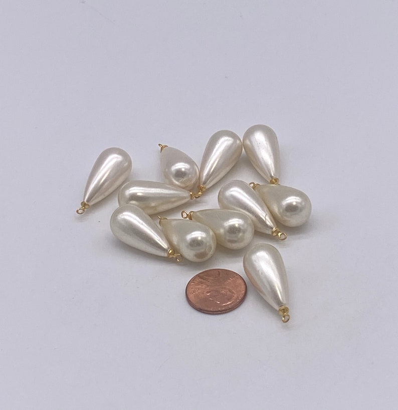 Large Pearly teardrops with gold plated eye pin. 12 pieces per price
