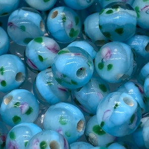 Round baby blue with pink floral motif bead. glass ( 20 pieces per price)