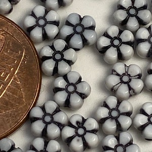 Petite acrylic black and white babies breath flower beads. 4mm.(200 pieces per price)