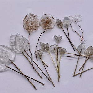 Mixed Floral glass beads/conponents. Clear/Transparent leaves and flowers. (22 pieces per price)