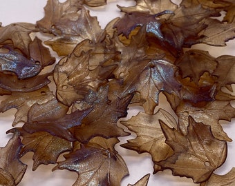 Hand painted maple leaves. Brown and iridescent purple/blue. 19mm, Acrylic. (20 pieces per price)