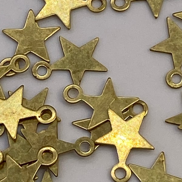 Small delicate brass stars. (60 peices per price)