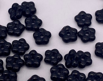 Petite glass flowers from Czech Republic. 5mm. Opaque Black. (50 pieces per price)