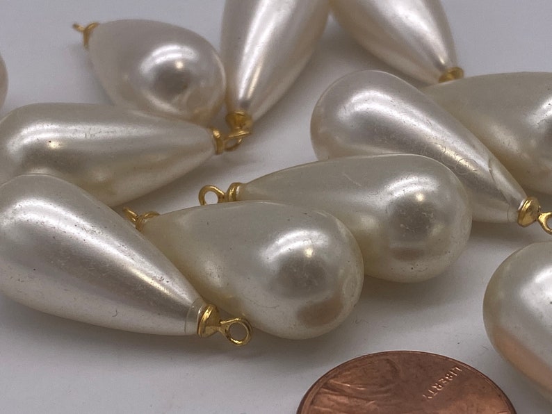 Large Pearly teardrops with gold plated eye pin. 12 pieces per price