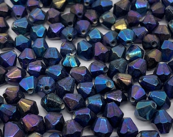 Cuentas Bicono de vidrio Preciosa con acabado AB. Índigo. 6 mm. (60 piezas por precio)