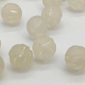Round frosted acrylic beads with cut groves from Germany. ( 40 pieces per price)