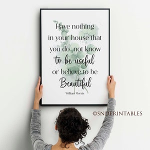 May include: A framed print with the quote "Have nothing in your house that you do not know to be useful or believe to be Beautiful" by William Morris. The print has a black frame and features green botanical accents.