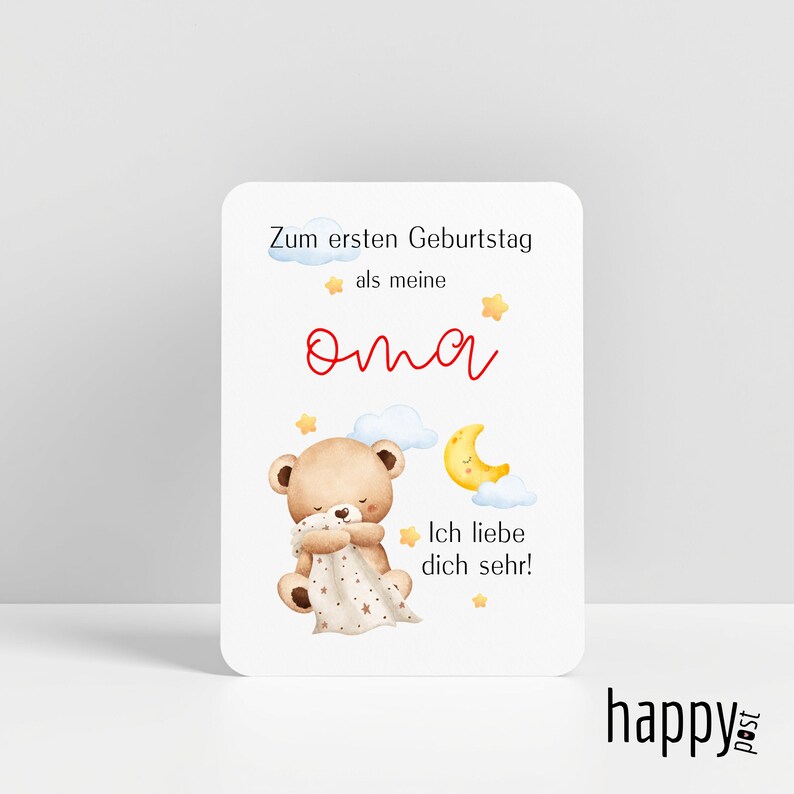 May include: A greeting card with a white background features a teddy bear holding a blanket, a crescent moon, and stars. The card has text in German, including "Zum ersten Geburtstag" and "Ich liebe dich sehr!"