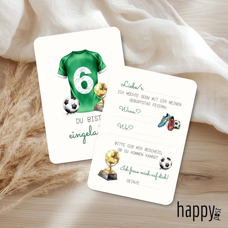 May include: Two white invitation cards with soccer-themed illustrations. One card features a green jersey with the number 6, a soccer ball, and a trophy. The other card has text in German and illustrations of soccer cleats and a soccer ball.