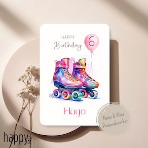 May include: A birthday card with a watercolour illustration of vibrant roller skates. The card displays "Happy Birthday" and the number "6" on a pink balloon. The name "Hugo" is also present on the card.