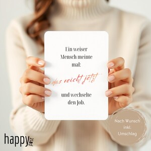 May include: A white card with rounded corners, held by a person, features German text in black and red. The card reads "Ein weiser Mensch meinte mal: das reicht jetzt und wechselte den Job." The Happy Post logo is visible.
