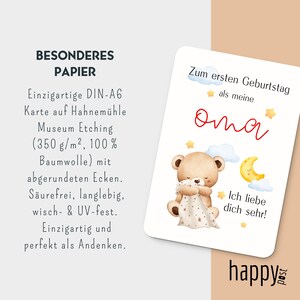 May include: A white card with a watercolor illustration of a teddy bear holding a blanket, a crescent moon, and stars. The card has German text that reads "Zum ersten Geburtstag als meine Oma. Ich liebe dich sehr!" and "happy post".