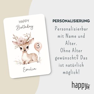 May include: A birthday card featuring a watercolor illustration of a fawn with floral antlers and a balloon with the number 3. The card has the text "HAPPY Birthday" and the name "Emilia".